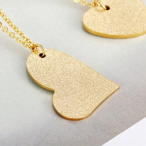 Minimalist gold sandblasted heart pendant necklace with elegant matte finish for women