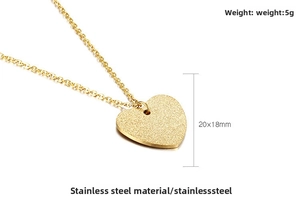 Detail of 20x18mm gold heart pendant necklace in frosted stainless steel finish