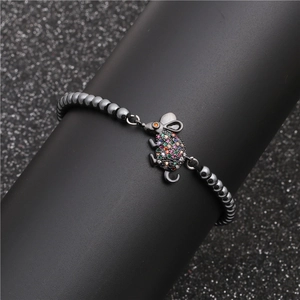 Beaded mouse bracelet with colorful zircons and black hematite stones on display stand