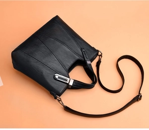 Elegante schwarze Handtasche mit großem Fassungsvermögen und dekorativen Ziernähten