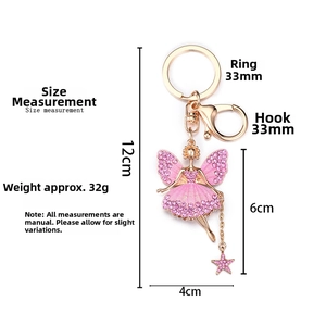 Pink rhinestone fairy keychain with dimensions showing golden metal wings and star charm