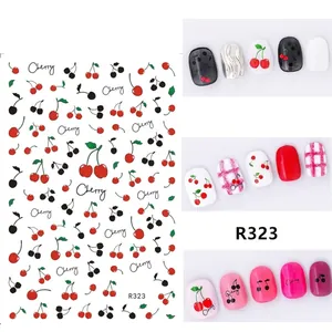 Macro shot of ultra-thin R323 cherry nail art decals with checkered patterns and script