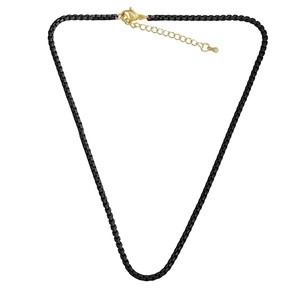 Detail of black box chain necklace featuring a gold lobster clasp and extension chain