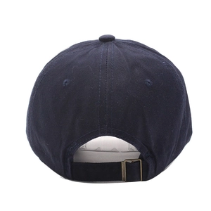 Detail view of the navy cotton baseball cap's back with adjustable vintage metal buckle