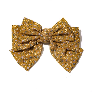 Floral three-layer oversized bow hair clip in ginger yellow fabric with purple flowers