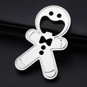 Detailed close-up of a silver gingerbread man metal bottle opener with hollow design