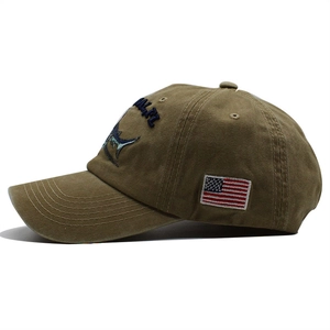 Washed cotton baseball cap in vintage tan with marlin embroidery and USA flag patch