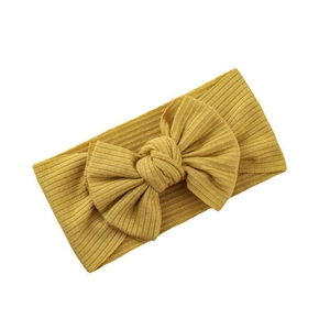 Mustard yellow ribbed knit baby headband with high-stretch bowknot on white background