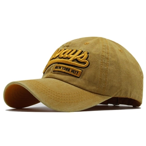 Detailed close-up of mustard yellow baseball cap with 3D Always New York embroidery