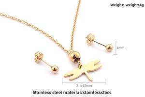 Detailed view of 18K gold plated dragonfly pendant necklace and 4mm stud earrings set