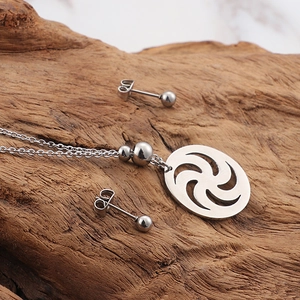 Stainless steel jewelry set featuring a spiral cutout pendant necklace and stud earrings