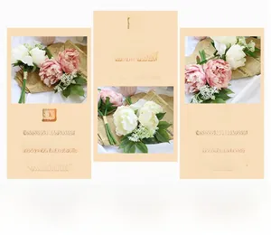 Macro view of vintage simulated peonies in pink and white with realistic green leaves