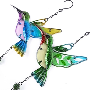 Set of two colorful metal and glass hummingbird hanging ornaments with metal chains