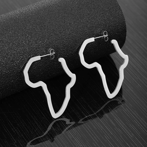 Polished stainless steel Africa map silhouette stud earrings on reflective display