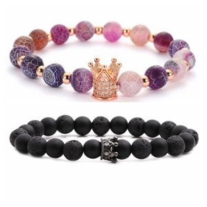 Detailed shot of beaded bracelets with crown charms in purple agate and black lava stone