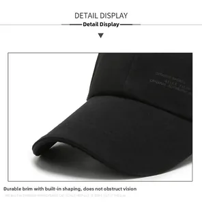 Detail of durable black baseball cap brim with multi-row stitching and GENUINE SPORTS text
