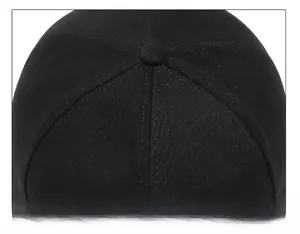 Close-up of black cotton baseball cap crown with reinforced stitching and button