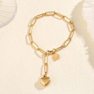 Minimalist gold paperclip chain bracelet featuring a polished heart pendant for women