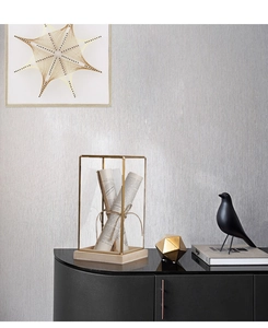 Detailed close-up of a Nordic brass glass showcase box with wood base and vintage paper rolls