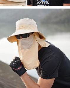Outdoor sun hat with detachable face mask and neck flap shown in natural water setting