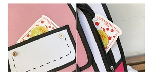 Detail view of pink 2D cartoon backpack showing magnetic buckle and smooth zipper closure