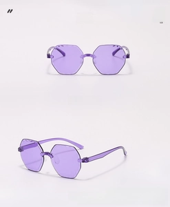 Detail view of purple rimless hexagonal sunglasses with stylish wavy lens edges
