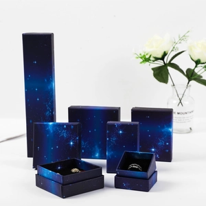 Starry blue jewelry gift boxes set for rings and necklaces on elegant white background
