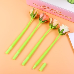 Close-up of four artificial rose gel pens in various colors with green floral stems