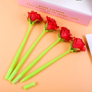 Close-up of four rose-shaped 0.5mm gel pens with red fabric flowers and green stems