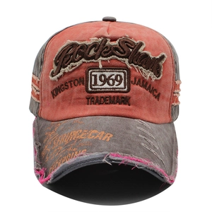 Detailed front view of 1969 vintage baseball cap with orange and grey distressed embroidery