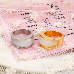 Fashionable stainless steel couple rings with white gemstone inlay in gold and silver