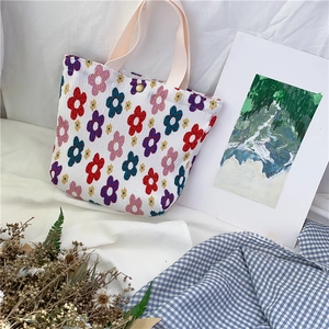 Mini borsa tote in tessuto increspato con stampe floreali colorate e manici in cotone