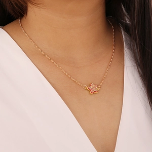 Minimalist gold necklace with a vibrant pink glittery star pendant for women style