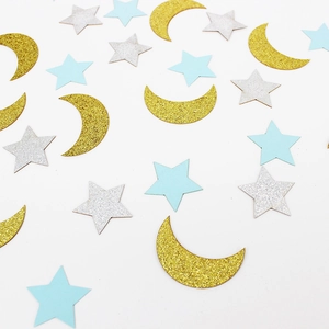 Star and moon glitter confetti for birthday party decor on white background