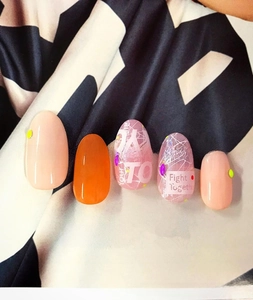 Detail of ultra-thin 3D nail stickers featuring fruit motifs and Fight Together lettering