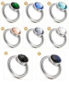 Macro detail of cat eye stone and crystal inlay options on steel rings with variant numbers