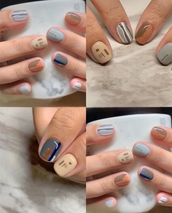 Detailed view of 3D nail art stickers with geometric blocks and gold dot accents