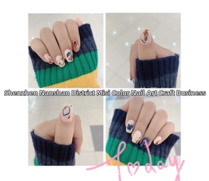 Detail of 3D abstract art nail stickers with colorful geometric patterns on beige base