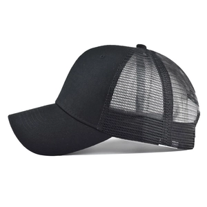 Side view of black cotton trucker hat showing breathable mesh and pre-curved brim