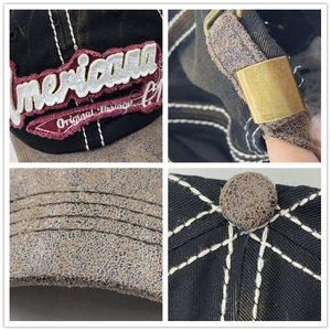 Vintage black baseball cap with brown brim featuring Americana embroidery and metal strap