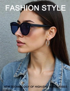 Detail of round sunglasses featuring intricate textured temples on fashion model