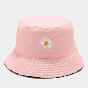 Detail of pink cotton bucket hat featuring daisy embroidery and reversible floral lining