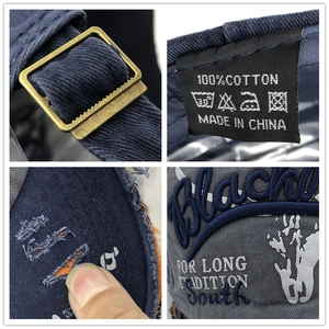 Distressed vintage washed cotton baseball cap with Black South embroidery and metal buckle