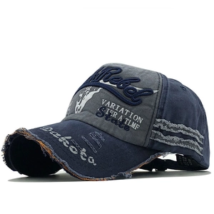 Close-up of vintage distressed baseball cap with Rebel embroidery and frayed edge details