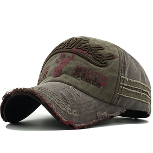 Distressed olive and brown canvas baseball cap with Rock Rebel embroidery and torn edges