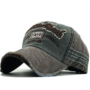 Vintage 1969 distressed baseball cap with embroidery and frayed edges on grey cotton canvas