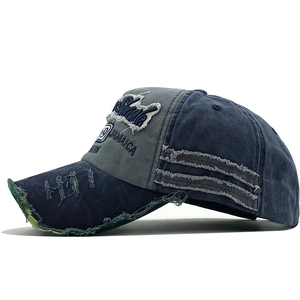 Close-up of distressed brim and 1969 vintage embroidery on this navy blue baseball cap
