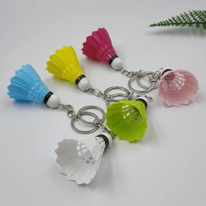 Set of five colorful badminton shuttlecock keychains in blue, yellow, white, green and pink