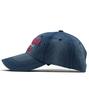 Detail of navy blue washed cotton cap with pink 3D embroidery and Detroit text