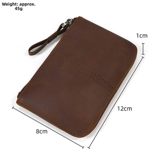 Detail view of a vintage dark brown crazy horse leather coin purse with size dimensions